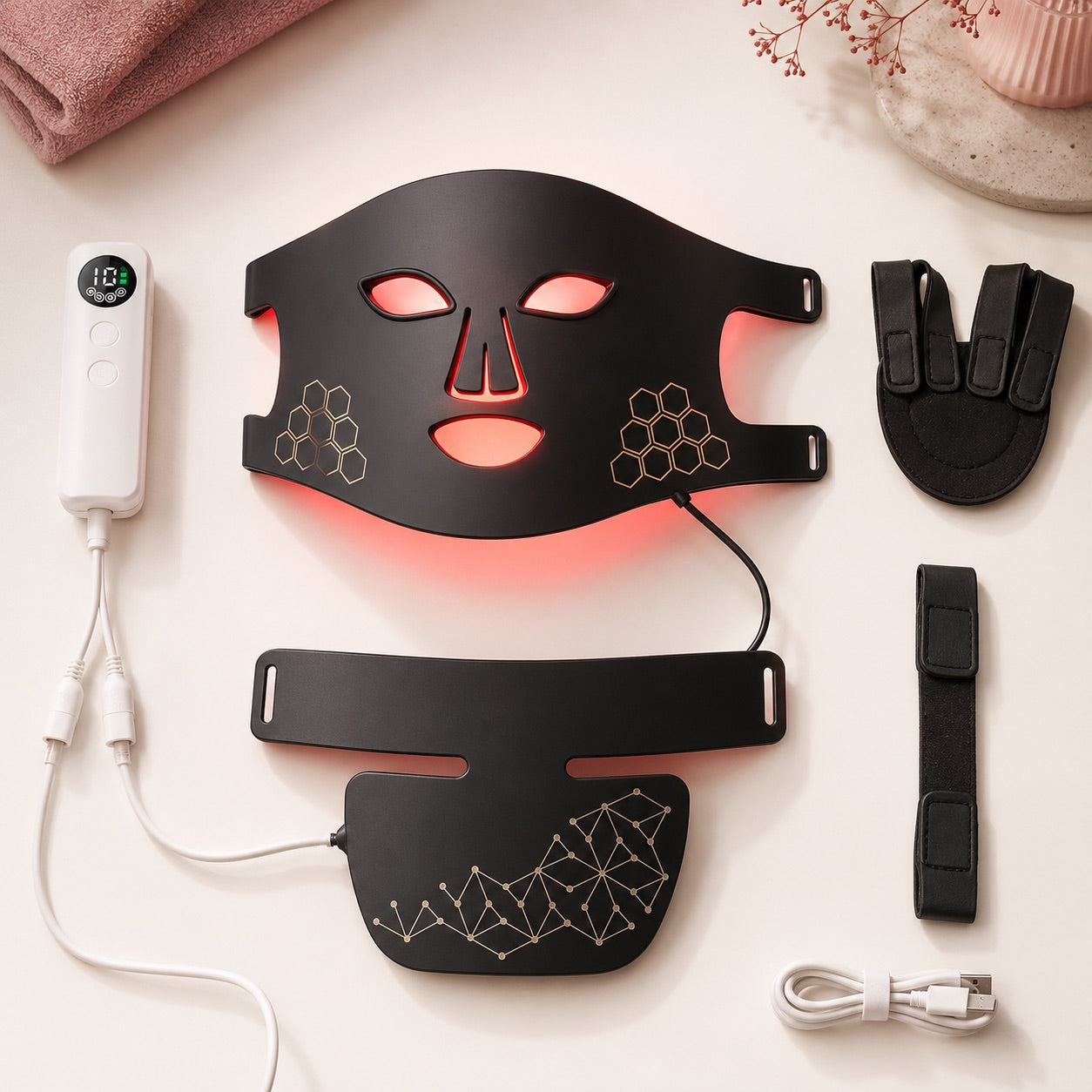 Black Rebound Halo face mask, neck attachment, controller, and straps laid out together