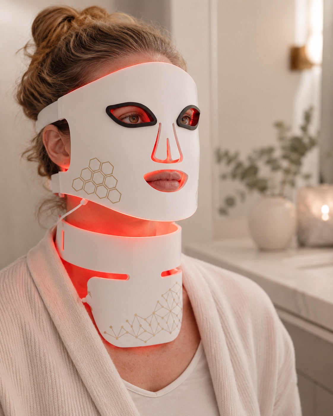 Woman using the Rebound Halo face mask and neck attachment